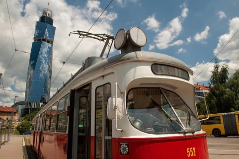 Sarajevo, Bosnia and Herzegovina July 25th 2019. An old tram waits at a tram stop with the Avaz
