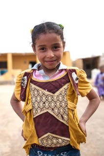 Siwa, Egypt. March 11th 2018 Portrait of a pretty young girl in a village near Siwa Oases. The Siwa