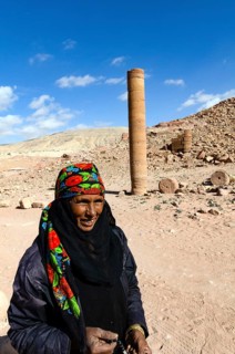 Petra, Jordan. December 11th 2012. A Jordanian Bedouin woman near a monument known as the Pharaohs