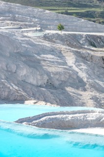 Pamukkale in western Turkey, the Cotton Castle, a natural mineral rich rock formation, aqua blue