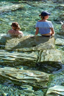 Pamukkale, Turkey, April 25th 2020 Foreign tourists enjoy the healing properties of thermal waters