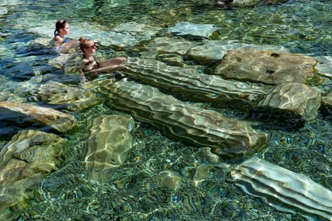 Pamukkale, Turkey, April 25th 2020 Foreign tourists enjoy the healing properties of thermal waters