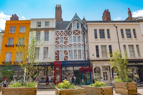Oxford, England. July 25th 2023 Beautiful historical architecture and modern shops along Broad