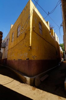 Aswan, Egypt. 8th January 2013 The bright yellow corner of a traditional house, a Nubian Village on