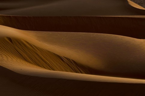 Shapes and shadows of Sand dunes in the desert of Oman near A'Sharqiyah Sands