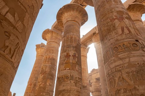 Ancient Egyptian Pharaoh hieroglyphic relief details on columns of the Great Hypostyle Hall of the