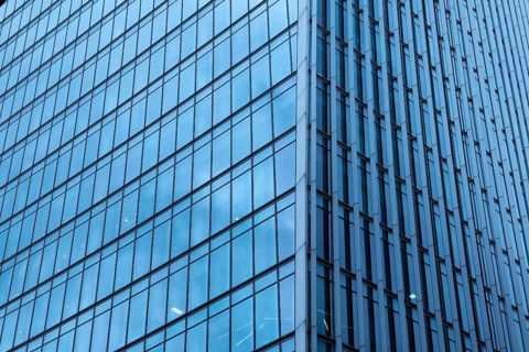 Modern abstract reflections in glass fronted commercial office buildings in the financial district