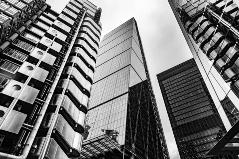Modern black and white abstract reflections in glass fronted office buildings in the financial