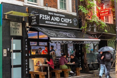 London, United Kingdom. August 2nd 2023 Traditional British Fish and Chip Shop in the rain, famous