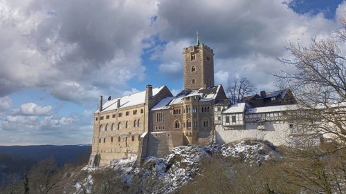 Wartburg in Eisenach, under partly cloudy winter skies, hiking on the Rennsteig, Thuringian Forest