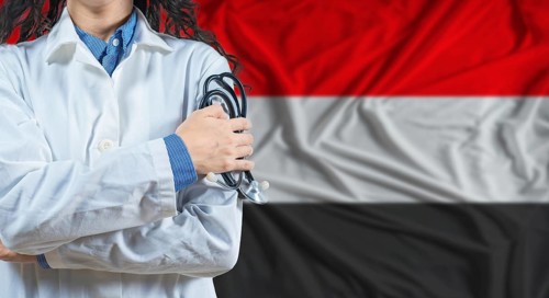 Healthcare professional with Yemen flag background. Professional doctor holding stethoscope on