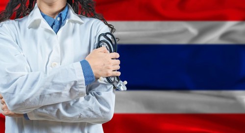 Healthcare professional with Thailand flag background. Professional doctor holding stethoscope on