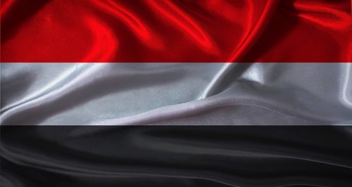 Yemen flag with cloth textured background. National flag of Yemen with realistic texture