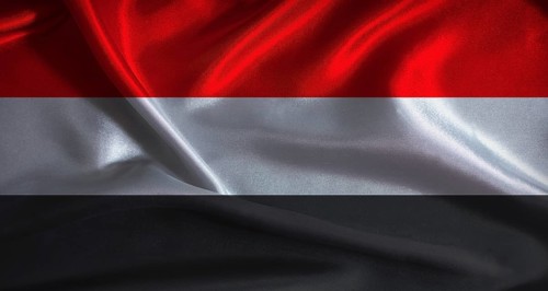 National flag of Yemen with cloth texture. Yemeni flag with realistic texture background