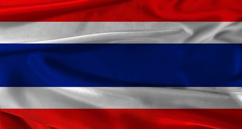 Flag of Thailand with fabric textured background. Close up of National flag of Thailand with