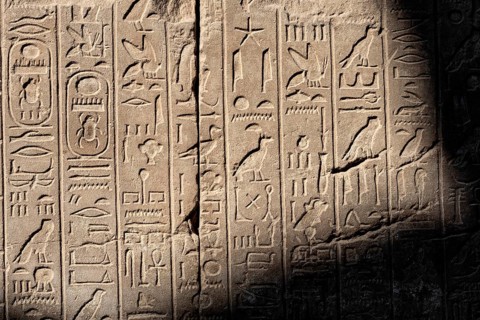 Ancient Egyptian stone cartouche hieroglyphic relief detail at Karnak Temple, Luxor. Egypt