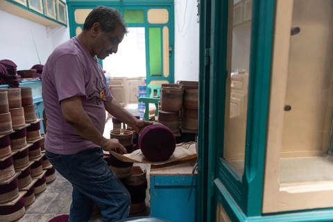 Tunis, Tunisia 22nd May, 2024 A Tunisian artisan uses an iron in the making of the traditional