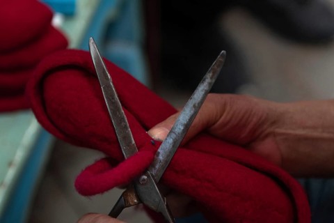 Tunis, Tunisia 22nd May, 2024 A Tunisian artisan puts the finishing touches to a red Chechia in