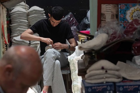 Tunis, Tunisia 22nd May, 2024 Tunisian workers sewing the traditional Chechia, a Tunisian craft