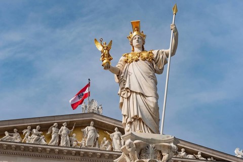 Vienna, Austria. October 5th 2023 Carved figures on the roof of the Parliament Building, part of a