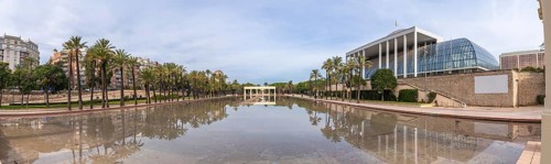 Palau de la musica, a modern architectural landmark, reflecting in the tranquil waters of the turia