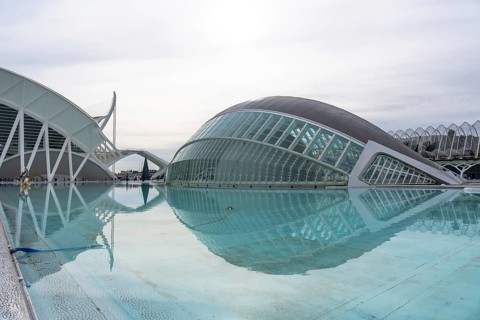 Valencia's city of arts and sciences complex features contemporary architecture reflecting in the