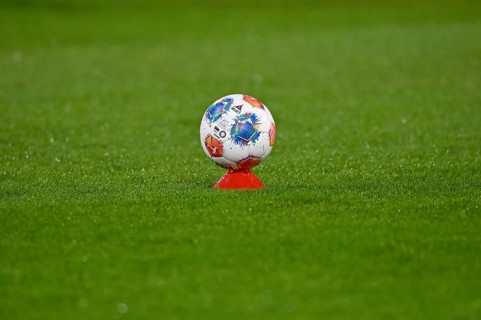 Adidas derby star game ball on hat, marker cap, on grass, soccer Bundesliga, Voith-Arena,