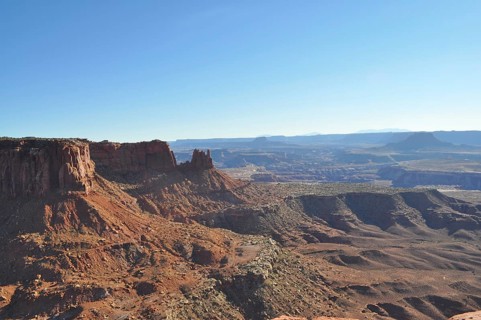 Red rocky canyon under clear blue sky with sweeping views, Canyonlands National Park, Island in the