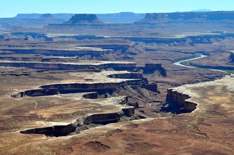Sublime canyon landscape with river, formed by erosion, under clear sky, Canyonlands National Park,