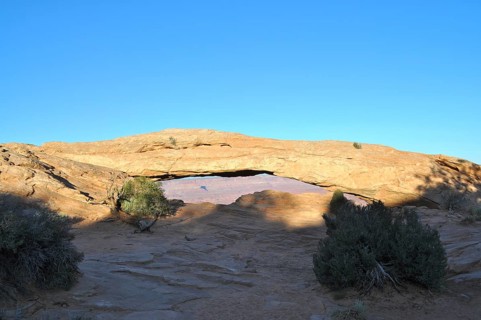 Mesa Arch forms a natural passageway in the desert landscape, Canyonlands National Park, Island in