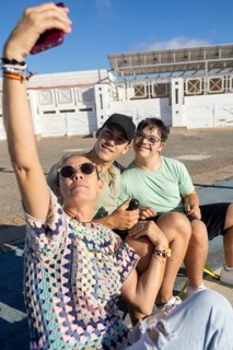 A heartwarming family moment as a teenager with Down Syndrome poses for a selfie with loved ones