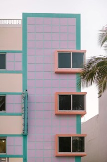 Vibrant image showing a Miami Beach Art Deco building with pastel pink and turquoise colors
