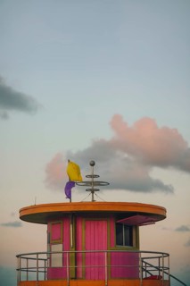 A picturesque view of a vibrant, colorful lifeguard tower on Miami Beach, captured under a softly