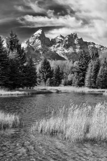 Dramatic black and white photograph capturing the rugged beauty of Grand Teton National Park,