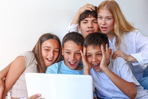 Five siblings, including a girl and two boy triplets, enjoy time with their elder brother and