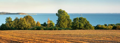 View of a ploughed field with a view of the Baltic Sea, Rügen Island, Mecklenburg-Western