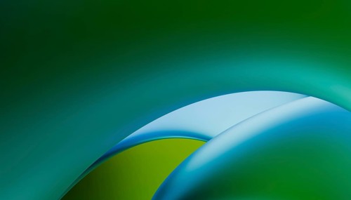 This image features smooth, flowing curves in vibrant shades of green and blue, set against a soft,