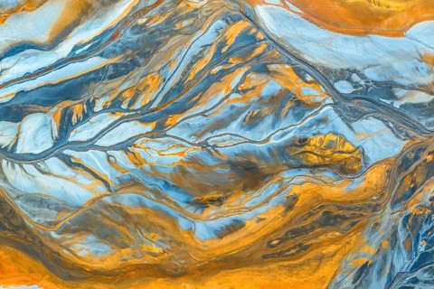 This image features an intricate multicolor abstract texture, showcasing vibrant blue and orange