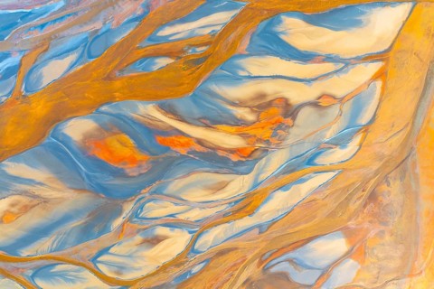 This image showcases a vibrant abstract design with swirling multicolor patterns, resembling fluid