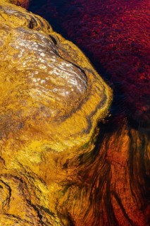 A close-up of the vibrant rock and water colors of the Riotinto river in Huelva, Spain The rich