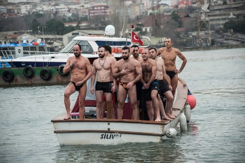 Istanbul, Turkey, January 6th 2017 Swimmers cross themselves and prepare to dive into the Golden
