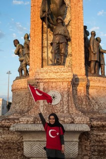 Taksim Square, Istanbul, Turkey. July 18th 2016 A proud Turkish girl with a Turkish flag poses in