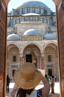A foreign tourist enters the Suleymaniye Camii, an Ottoman imperial Mosque over looking Istanbul