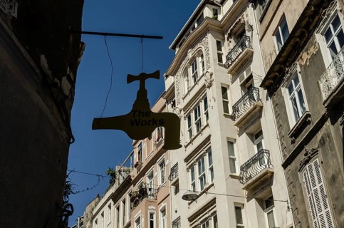 Istanbul, Turkey. 14th May 2015 The Works Antique shop sign hangs in front of typical European