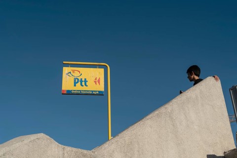 Istanbul, Turkey. October 3rd 2021 Bright Yellow PTT sign, the Turkish Post Office against a deep