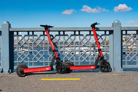 Istanbul, Turkey. October 5th 2021 Environmentally friendly red electric scooters parked on the