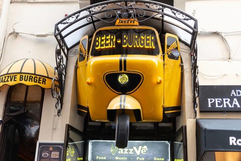 August 2nd 2021 Istanbul, Turkey Quirky Yellow Sign for Jazz Ve Beer and Burger Bar near Istiklal