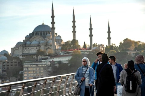 Istanbul, Turkey. November 14th 2023 Commuters leave Halic Metro station with the minarets of