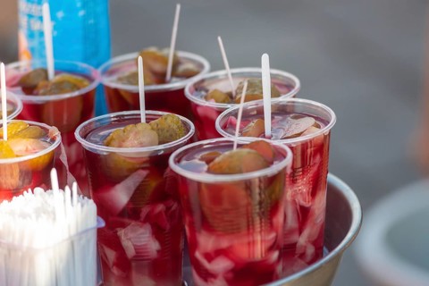 Glasses of fermented pickle juice for sale beside fish restaurants in Istanbul, the popular