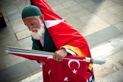 Istanbul, Turkey. May 6th 2016 A bearded Turkish man selling flags on the streets of Istanbul,